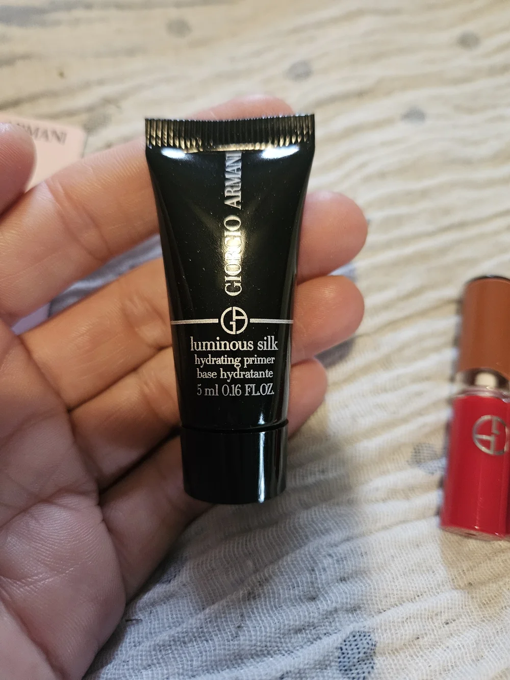 4 Giorgio Armani;  2 Lip in Venetian Red, gloss and primer.